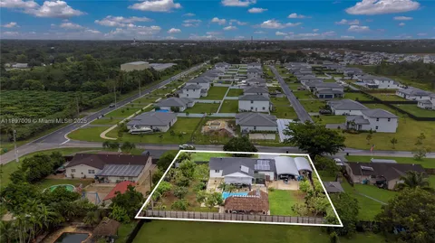 an aerial view of a house with a garden