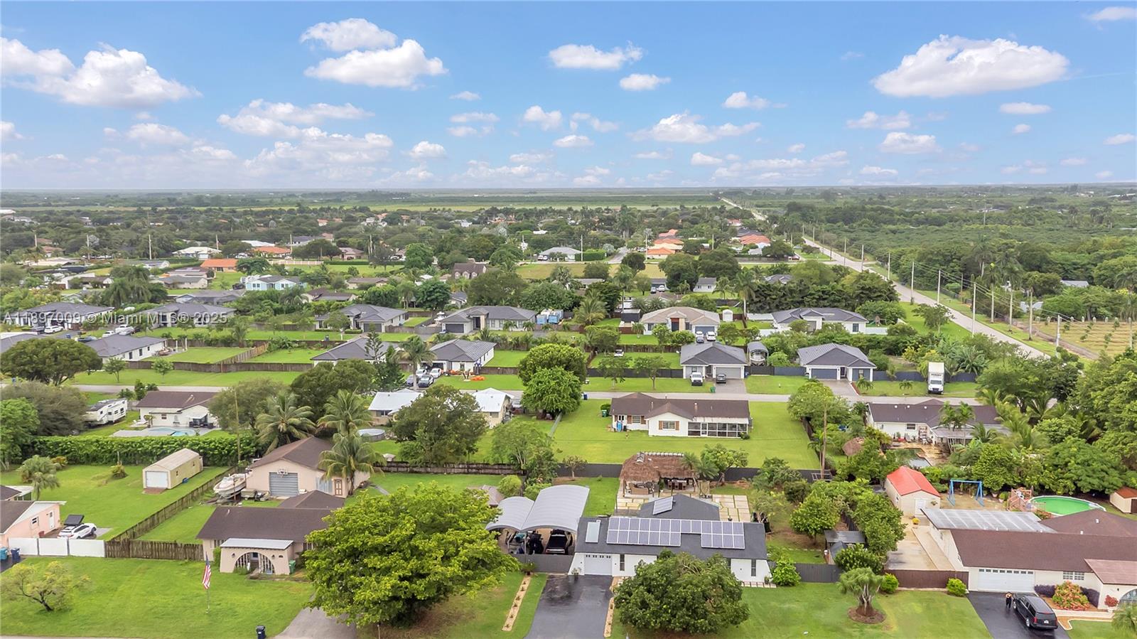 32020 Southwest 199th Avenue Homestead, FL 33030 - Photo 43 of 43 an aerial view of residential houses with outdoor space and trees
