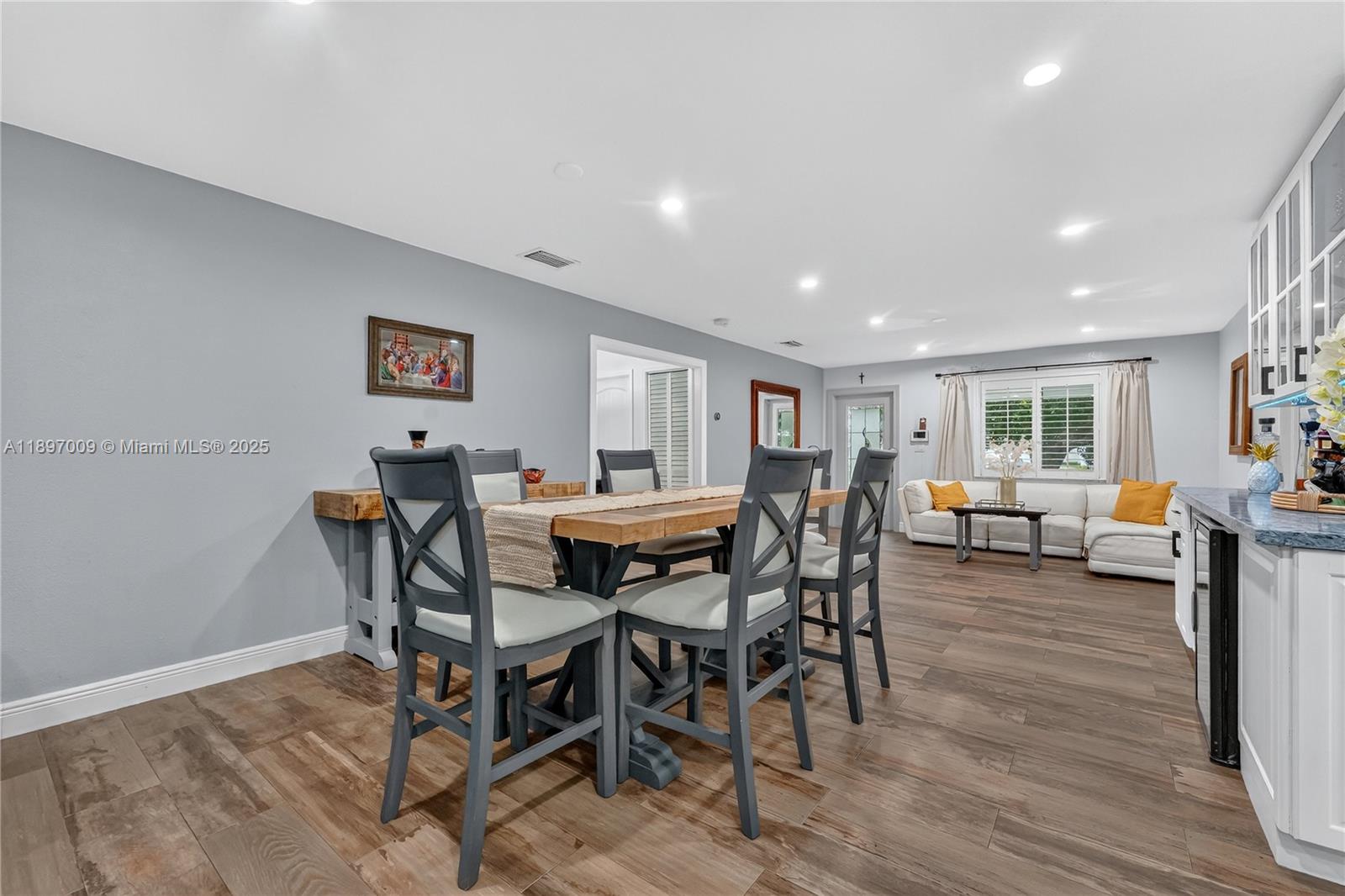 32020 Southwest 199th Avenue Homestead, FL 33030 - Photo 8 of 43 a view of a dining room with furniture and wooden floor