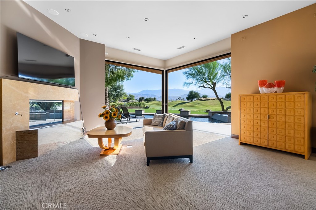 68 Royal St Georges Way Rancho Mirage, CA 92270 - Photo 48 of 75 a living room with furniture and a flat screen tv
