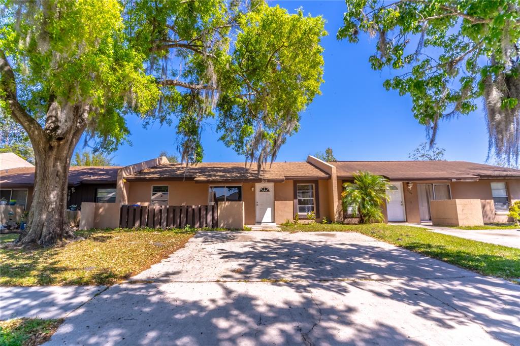 3143 Stonecastle Road Orlando, FL 32822 - Photo 1 of 1 a front view of a house with a yard