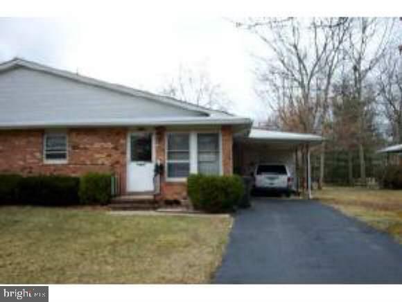 32 Cranberry Road Manahawkin, NJ 08050 - Photo 1 of 2 a front view of a house with a garden
