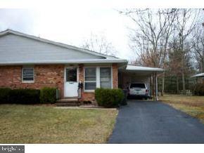 32 Cranberry Road Manahawkin, NJ 08050 - Photo 2 of 2 a front view of a house with garden