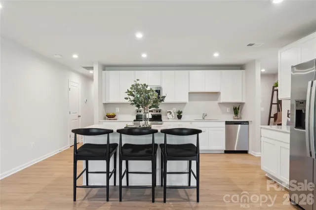 a kitchen with a table and chairs in it