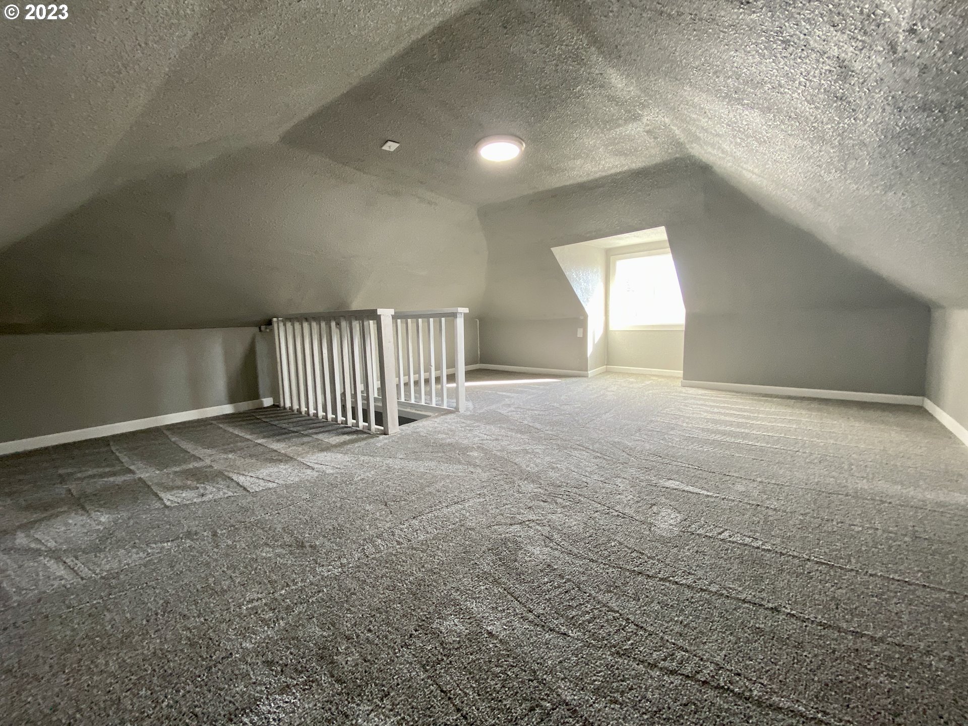 417 East Court Street Goldendale, WA 98620 - Photo 15 of 19 a view of an empty room with a fireplace