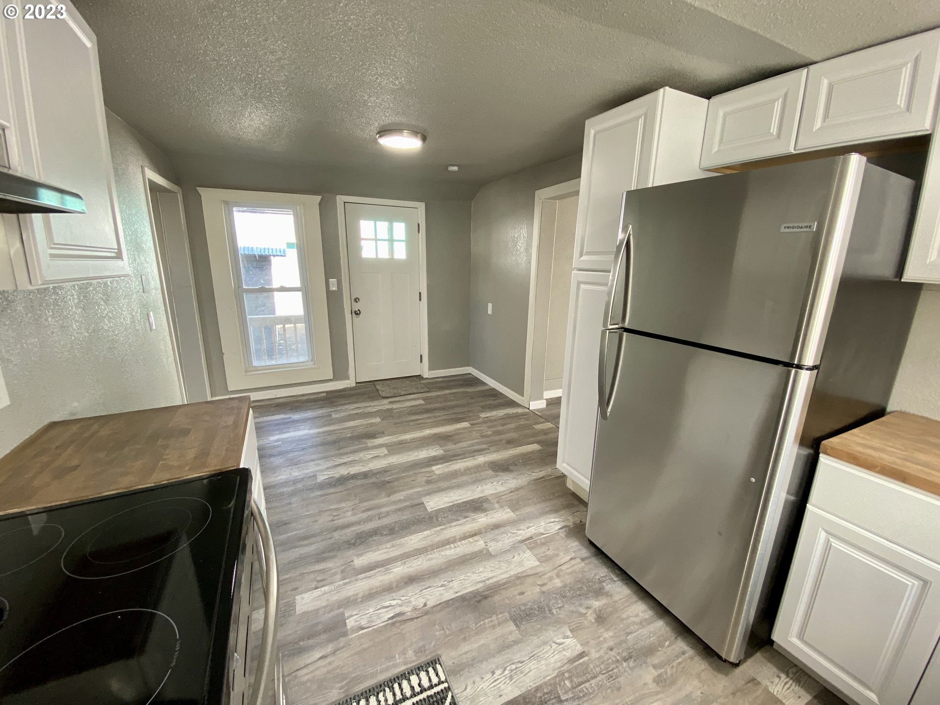 417 East Court Street Goldendale, WA 98620 - Photo 8 of 19 a kitchen with stainless steel appliances a refrigerator and a sink