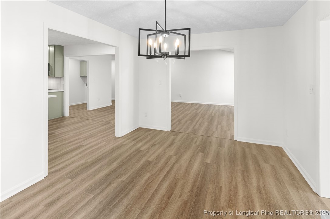 3638 Golfview Road Hope Mills, NC 28348 - Photo 15 of 35 a view of a room with wooden floor and staircase