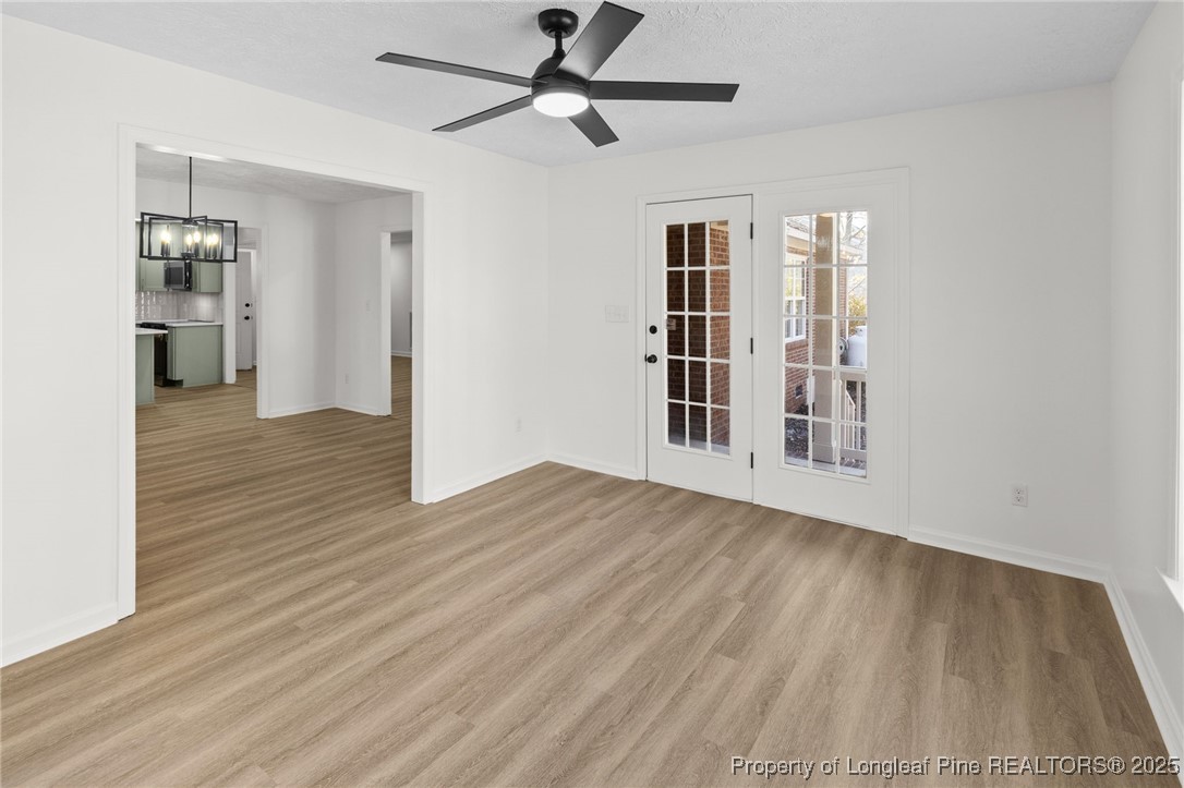 3638 Golfview Road Hope Mills, NC 28348 - Photo 19 of 35 a view of empty room with wooden floor and fan