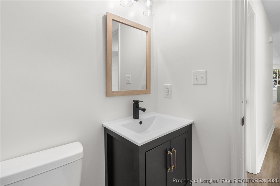 3638 Golfview Road Hope Mills, NC 28348 - Photo 23 of 35 a bathroom with a sink and a toilet