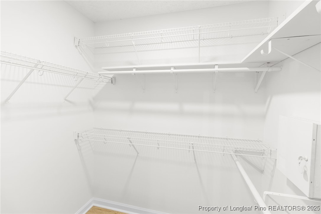 3638 Golfview Road Hope Mills, NC 28348 - Photo 31 of 35 a view of a closet with racks on the wall