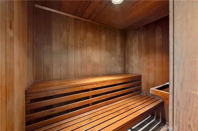 a sitting area with wooden floors