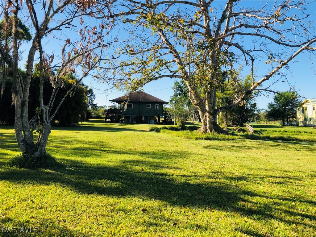 17720 Taylor Road Alva, FL 33920 - Photo 2 of 10 a view of swimming pool with an outdoor space and seating area