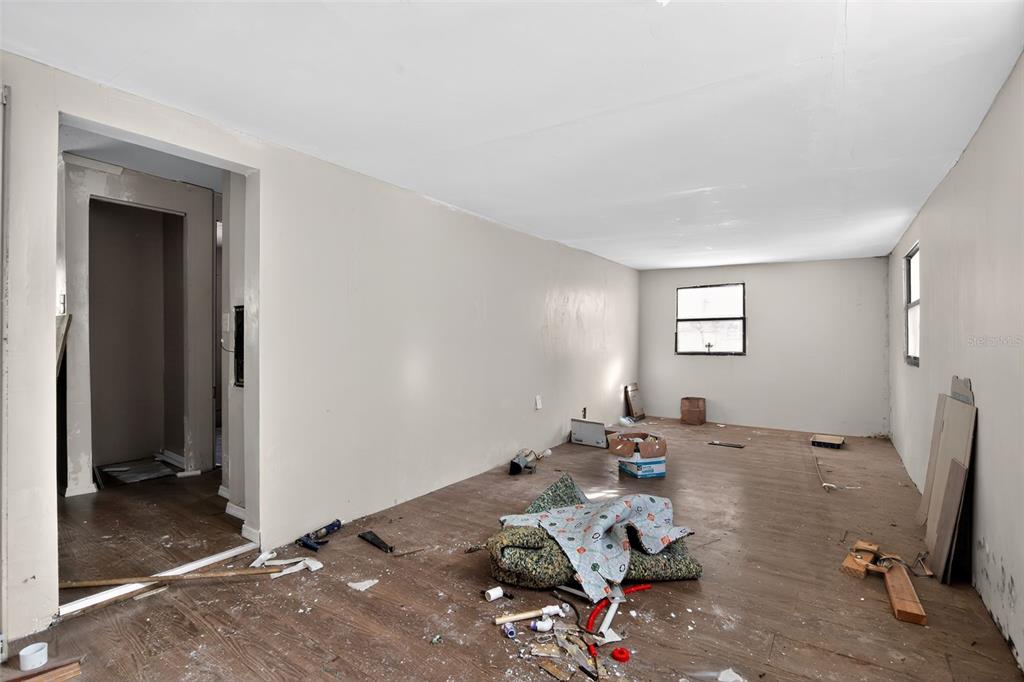 3140 Northeast 162 Place Citra, FL 32113 - Photo 12 of 30 a living room with furniture and a window