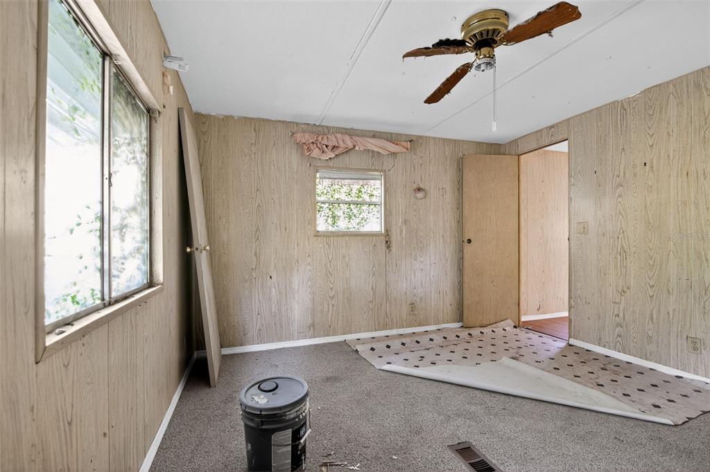 3140 Northeast 162 Place Citra, FL 32113 - Photo 18 of 30 a bedroom with a bed and a window