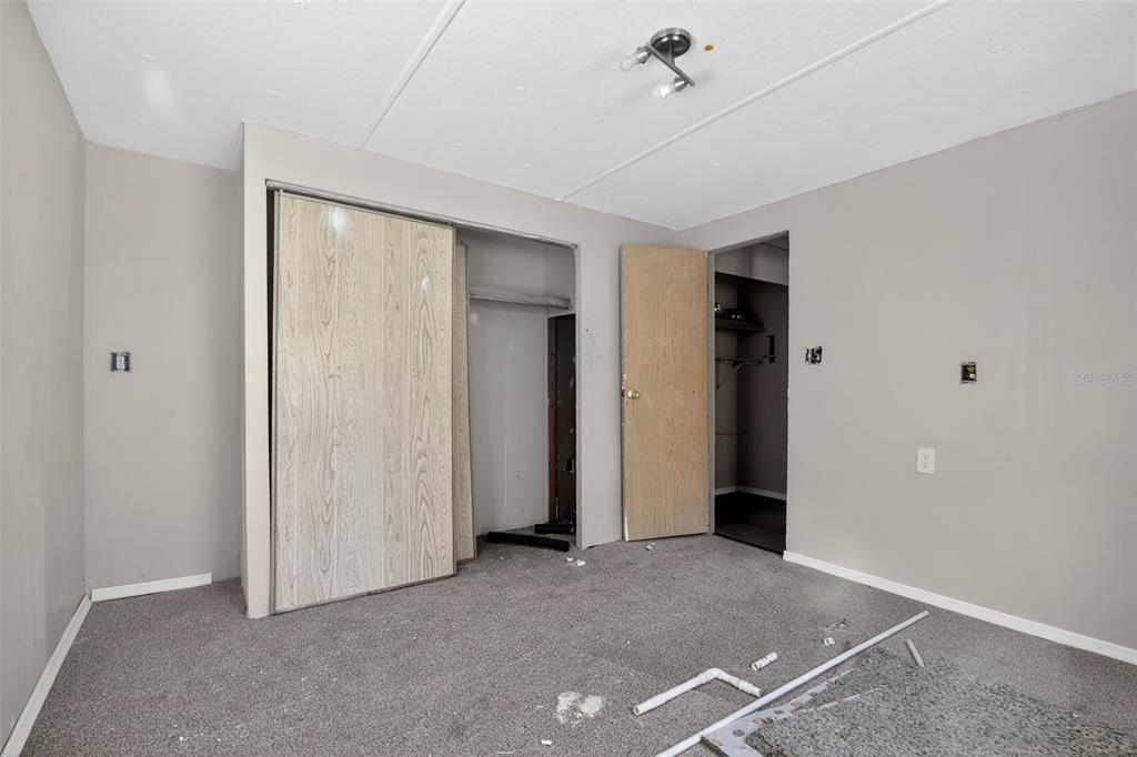 3140 Northeast 162 Place Citra, FL 32113 - Photo 19 of 30 an empty room with chandelier fan