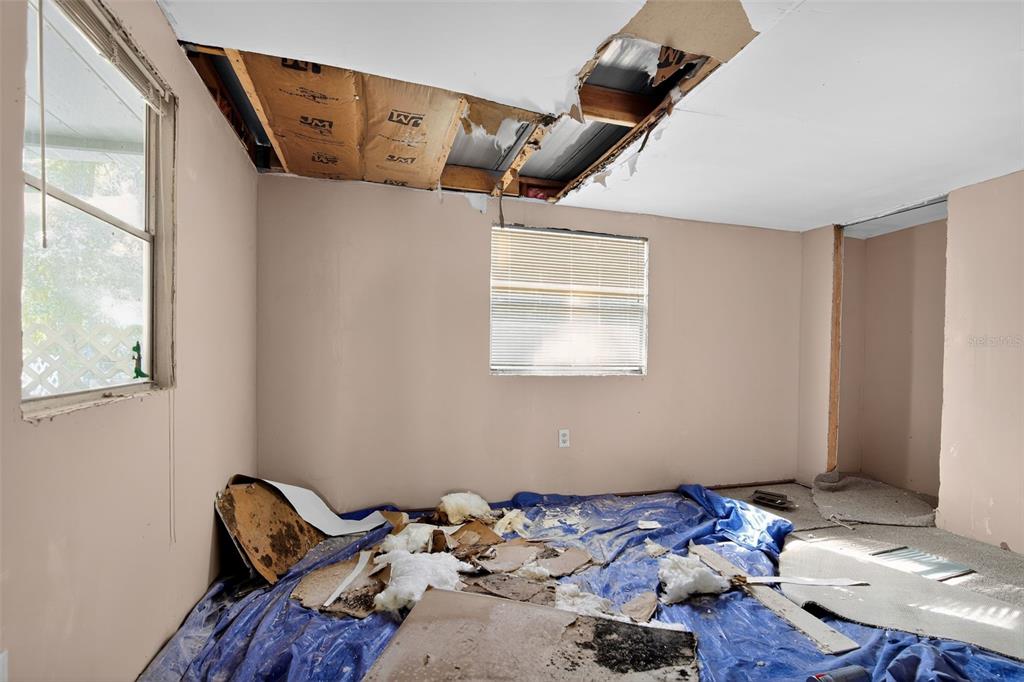 3140 Northeast 162 Place Citra, FL 32113 - Photo 20 of 30 a bed room with a bed and wooden floor