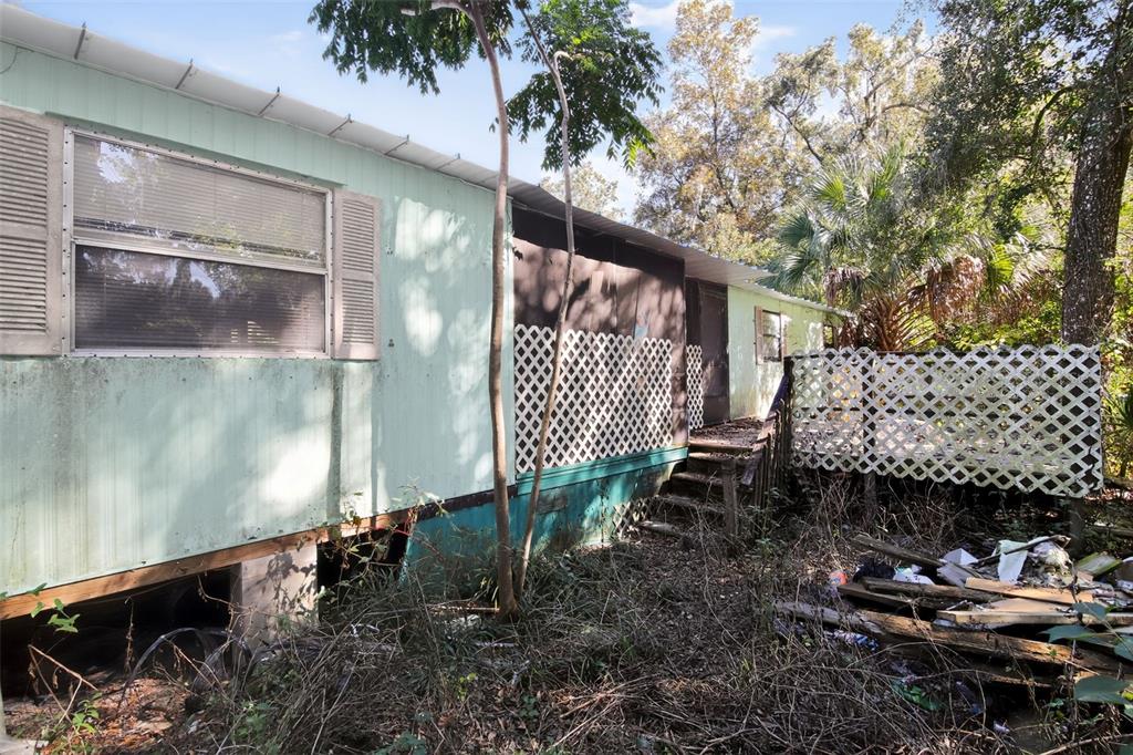 3140 Northeast 162 Place Citra, FL 32113 - Photo 2 of 30 a front view of a house with a yard