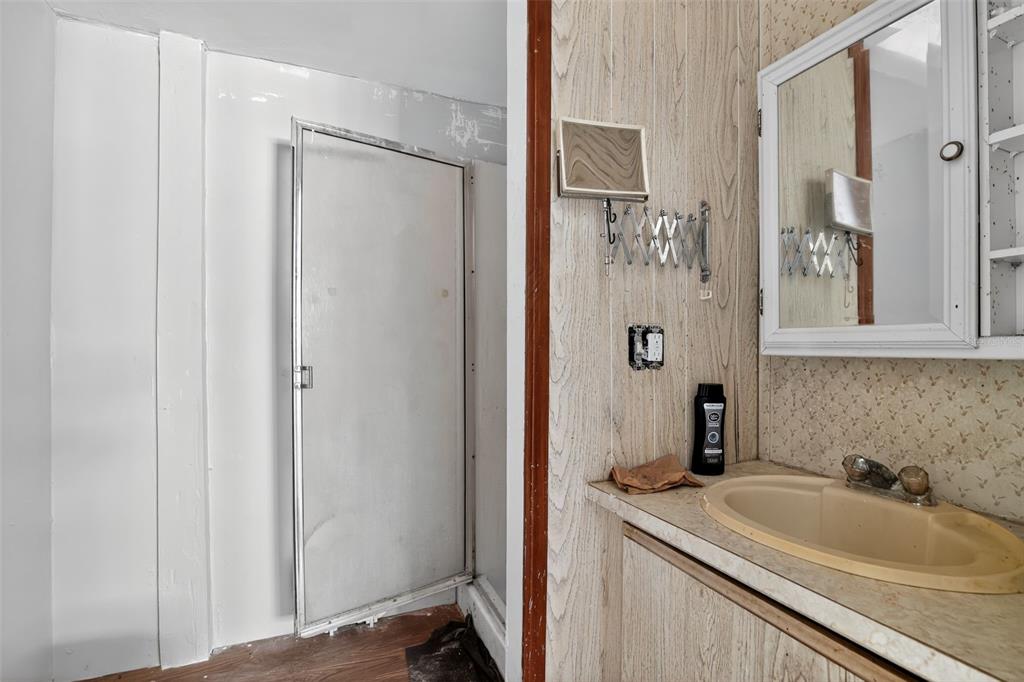 3140 Northeast 162 Place Citra, FL 32113 - Photo 25 of 30 a bathroom with a sink and mirror