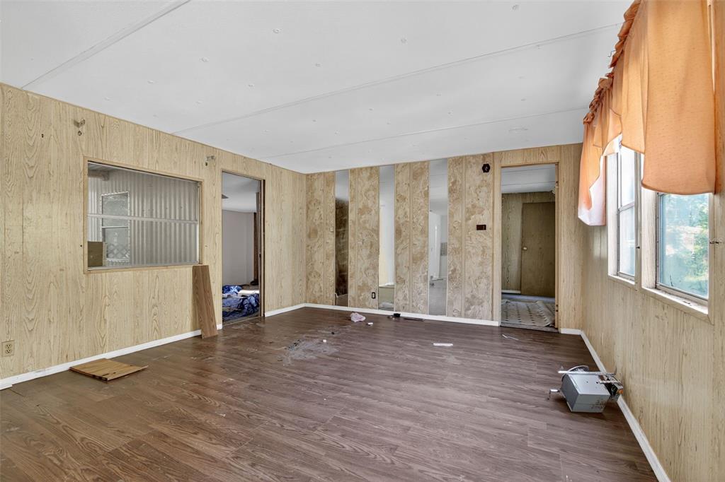 3140 Northeast 162 Place Citra, FL 32113 - Photo 10 of 30 a view of an empty room with wooden floor and a window