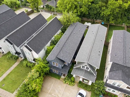 an aerial view of a house with a garden