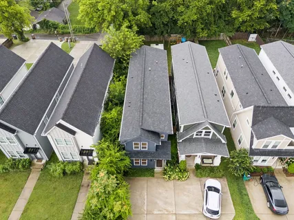 an aerial view of multiple houses with outdoor space