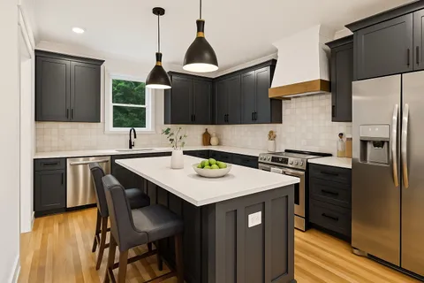a kitchen with a stove a sink and a refrigerator