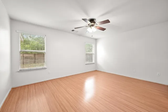 a spacious bedroom with a bed and a couch