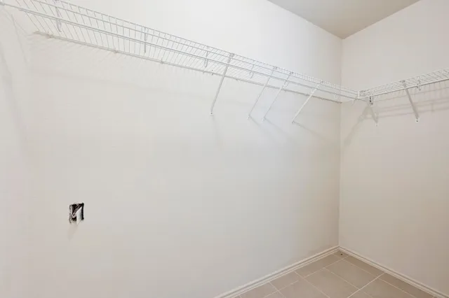 a white bath tub with a shower