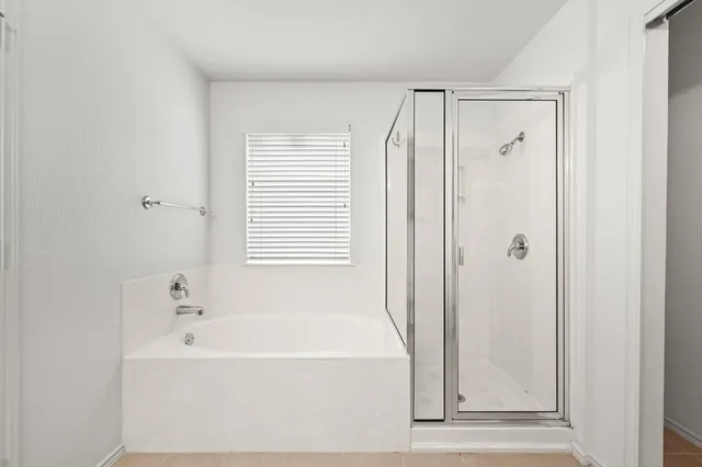 a bathroom with a double vanity sink a toilet and a mirror