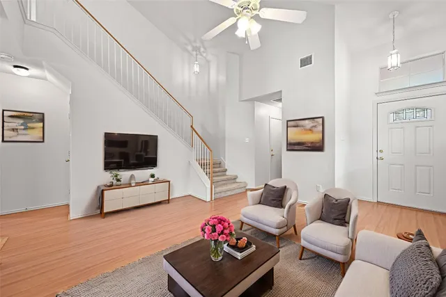 a view of a bedroom with wooden floor