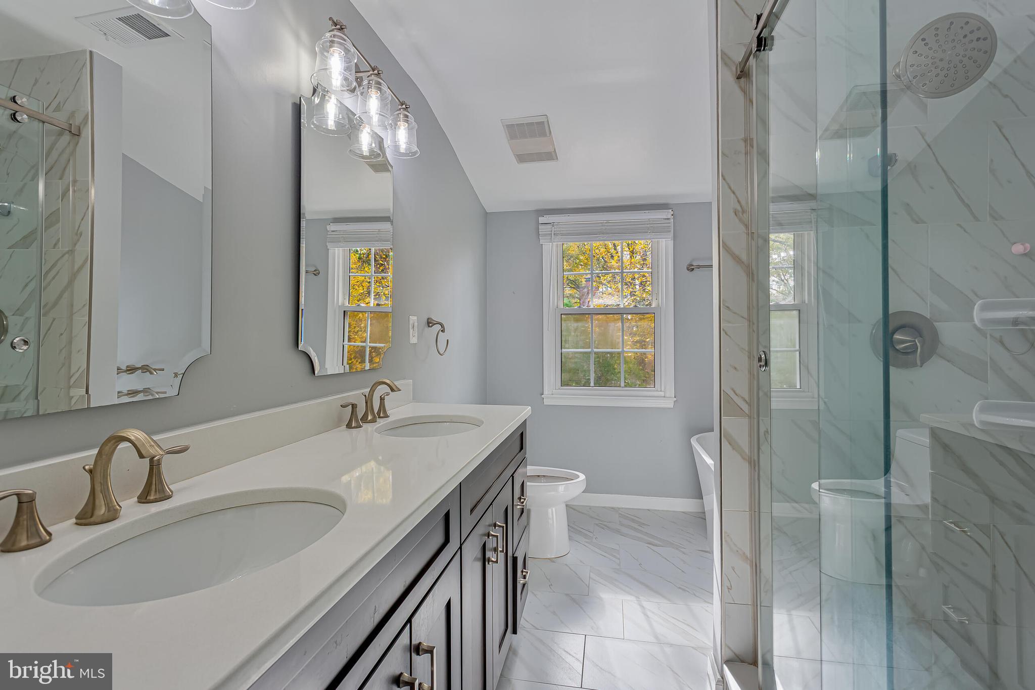 12027 Cheviot Drive Herndon, VA 20170 - Photo 15 of 29 a bathroom with a sink and a mirror