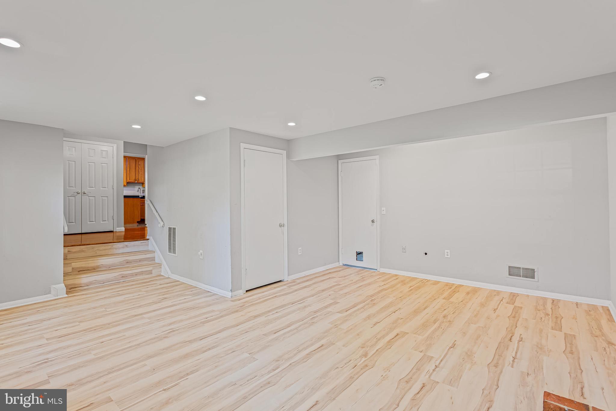 12027 Cheviot Drive Herndon, VA 20170 - Photo 24 of 29 a view of an empty room with wooden floor