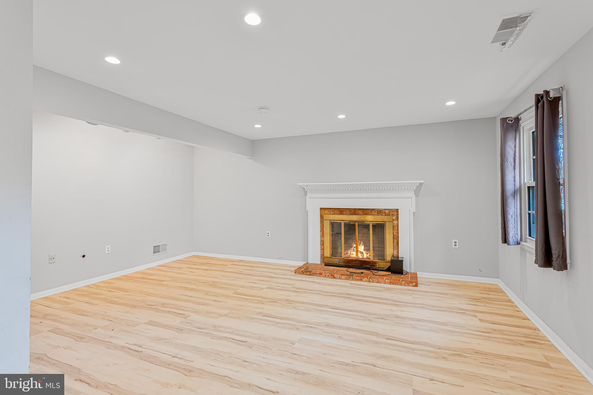 12027 Cheviot Drive Herndon, VA 20170 - Photo 26 of 29 a view of empty room with wooden floor and fan