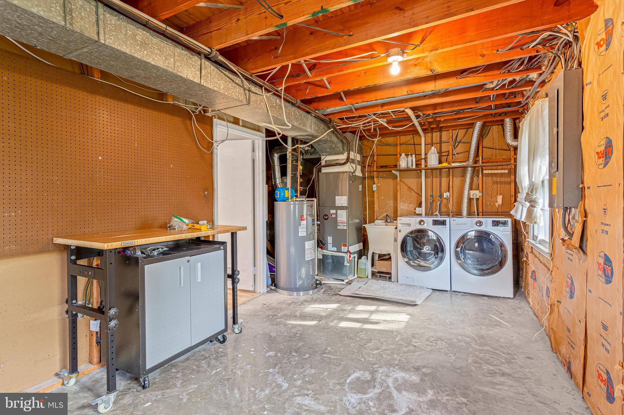 12027 Cheviot Drive Herndon, VA 20170 - Photo 27 of 29 a view of a storage room with a blue car parked