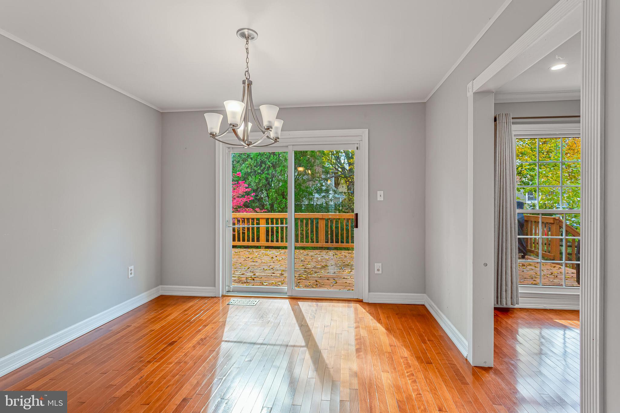 12027 Cheviot Drive Herndon, VA 20170 - Photo 10 of 29 a view of empty room with wooden floor and fan