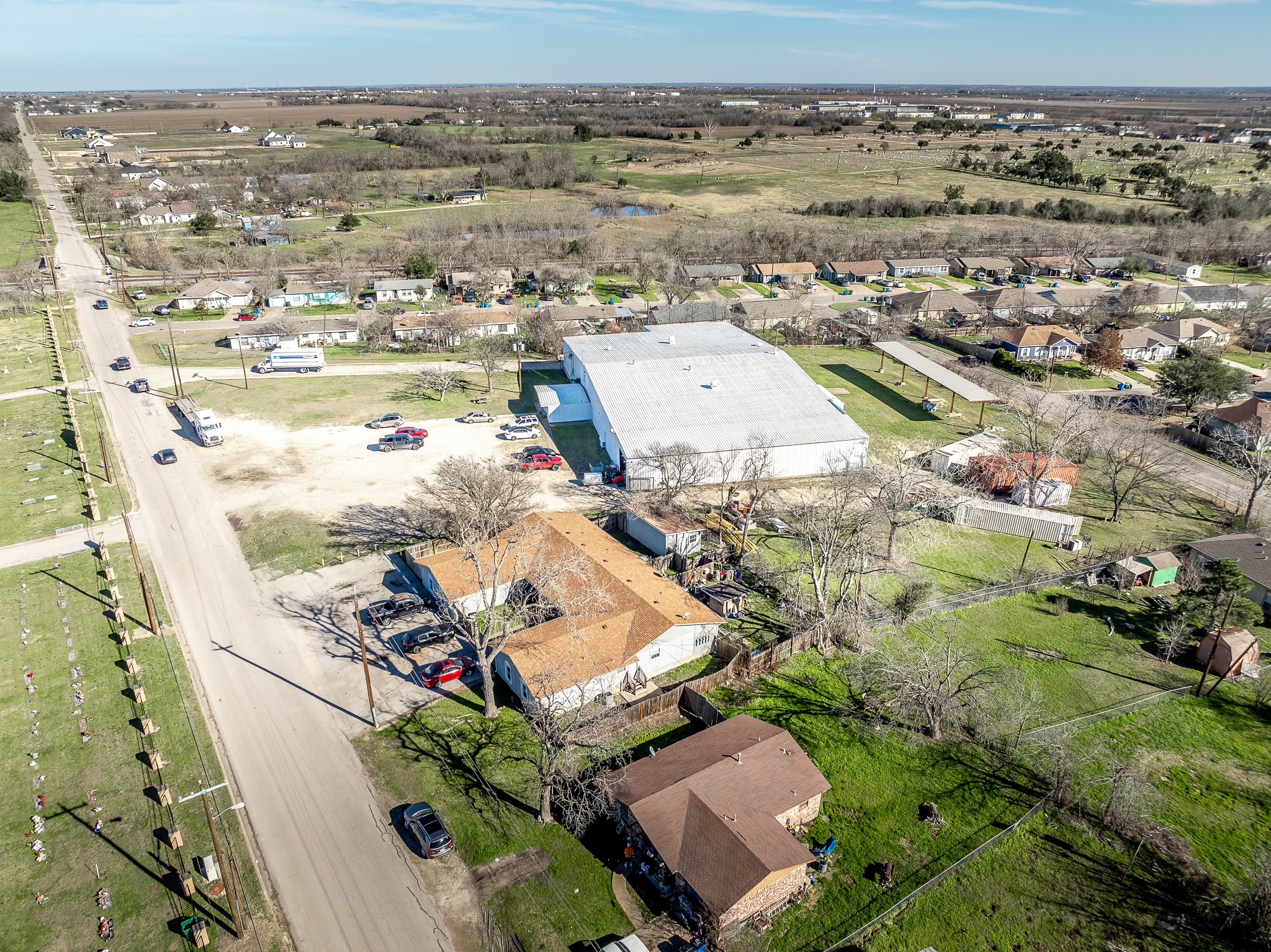 410 Old Thorndale Road, Unit D Taylor, TX 76574 - Photo 3 of 14 Aerial perspective showcasing commercial building with extensive lot space
