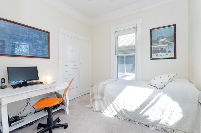 149 Scottswood Road Riverside, IL 60546 - Photo 8 of 24 a bedroom with a bed and chair