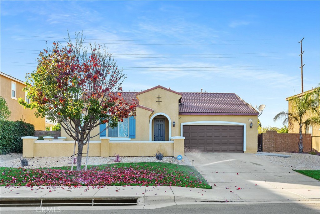 30679 View Ridge Lane Menifee, CA 92584 - Photo 1 of 1 a front view of a house with a yard and garage