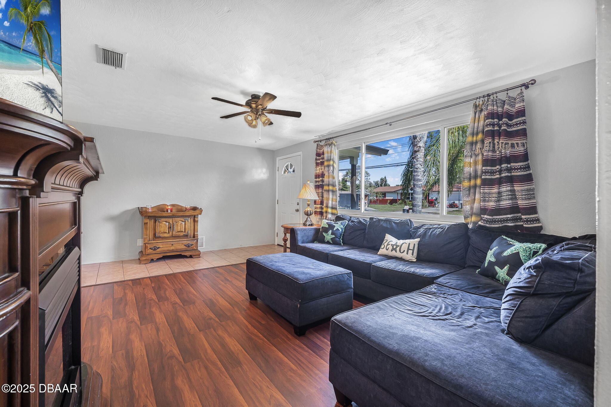 737 5th Street Port Orange, FL 32129 - Photo 16 of 40 a living room with furniture and a flat screen tv