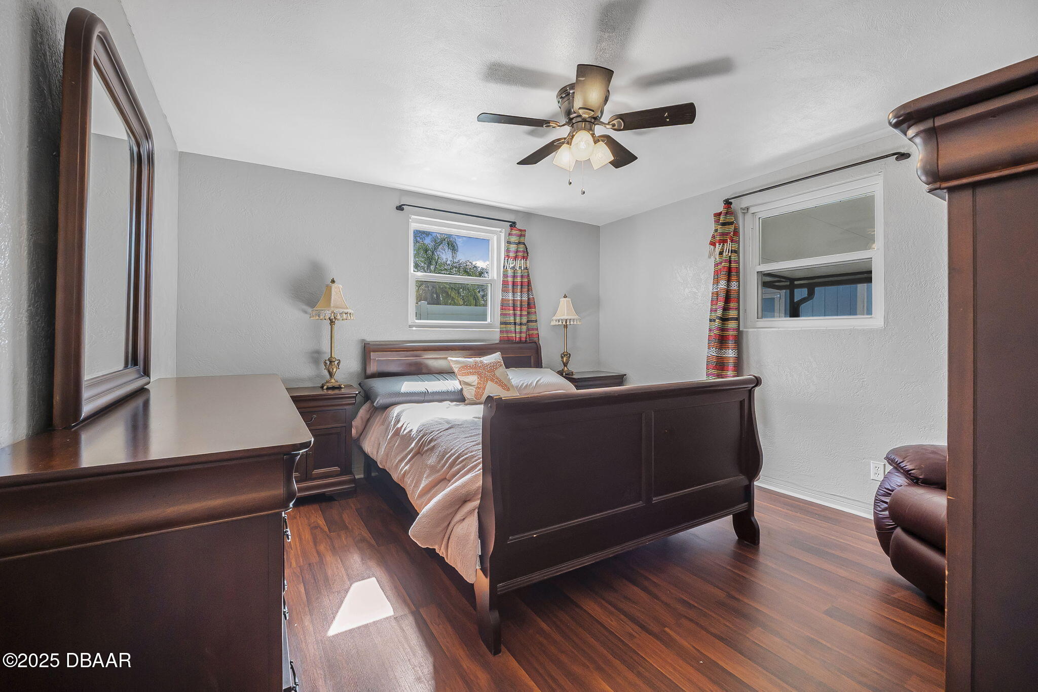 737 5th Street Port Orange, FL 32129 - Photo 21 of 40 a living room with a bed furniture and a window