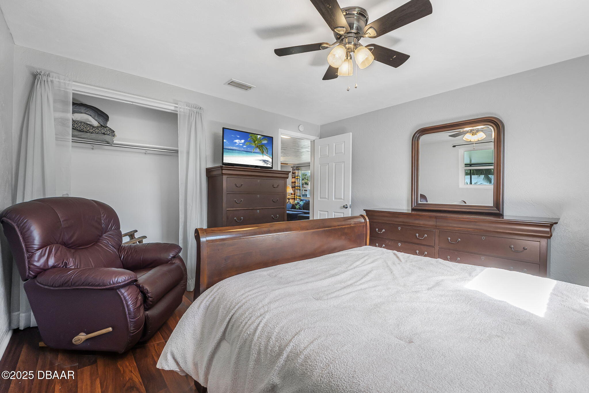 737 5th Street Port Orange, FL 32129 - Photo 23 of 40 a bedroom with a bed couch and a window