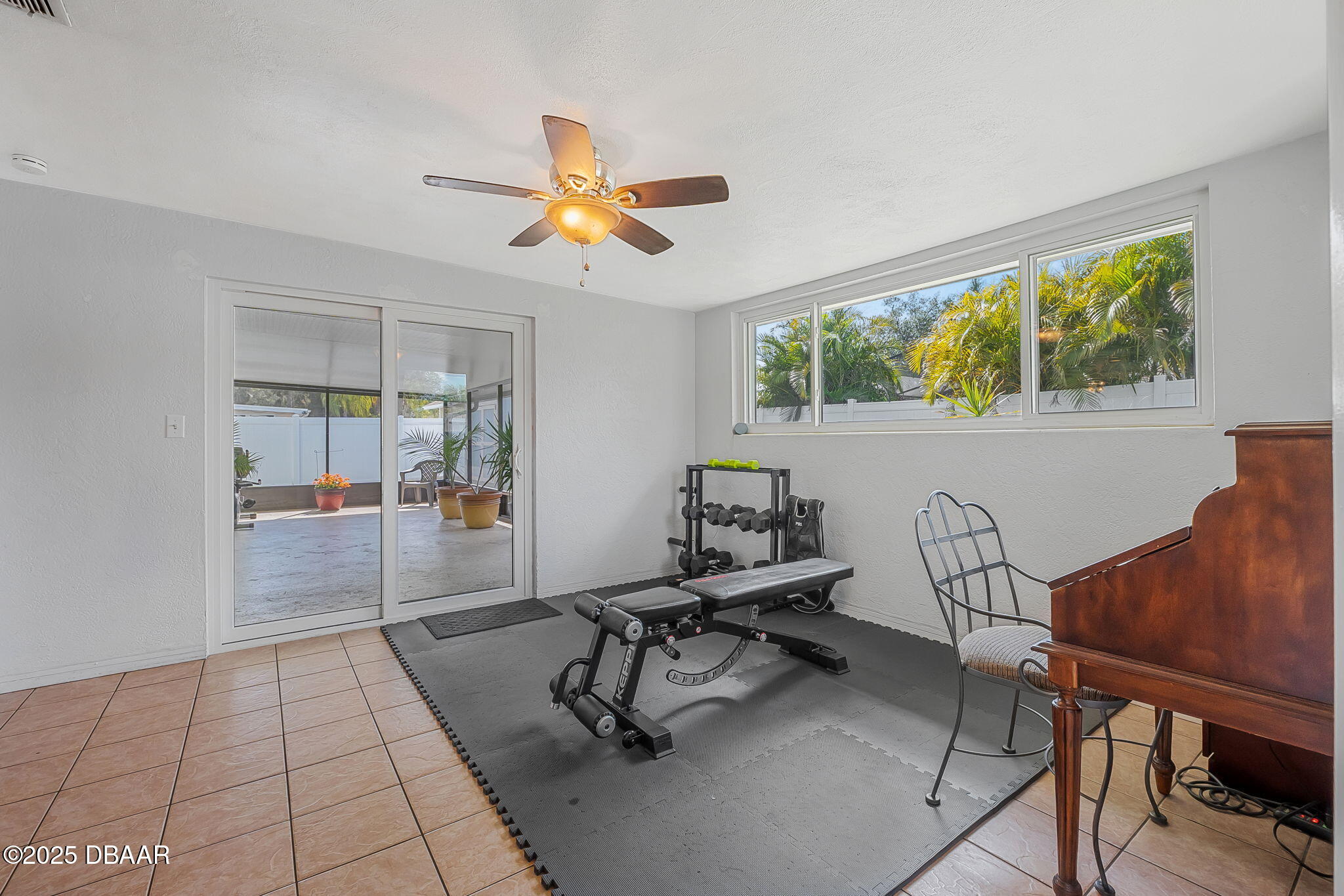 737 5th Street Port Orange, FL 32129 - Photo 25 of 40 a view of a workspace with furniture and a window