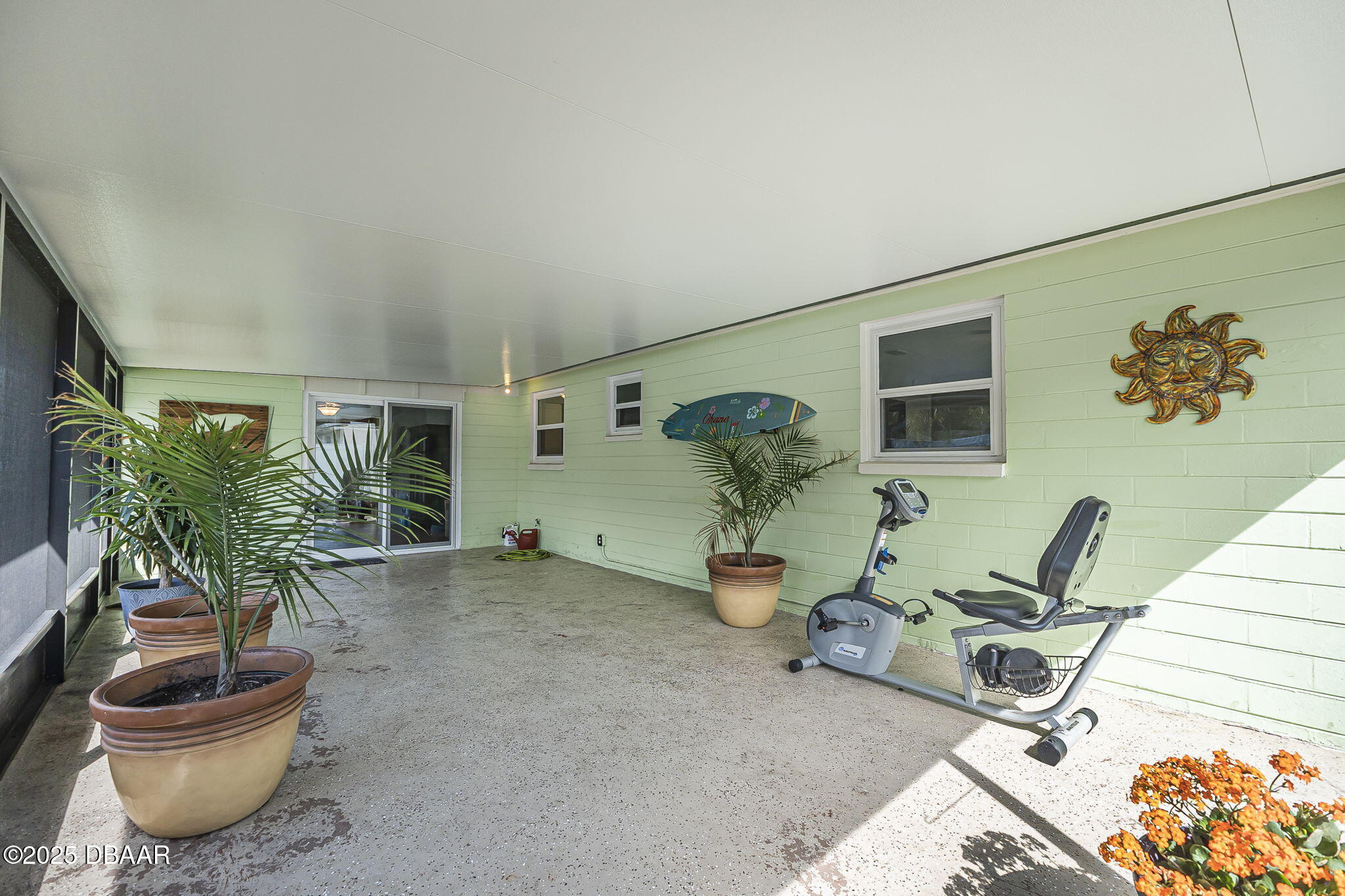 737 5th Street Port Orange, FL 32129 - Photo 30 of 40 a living room with furniture and a potted plant