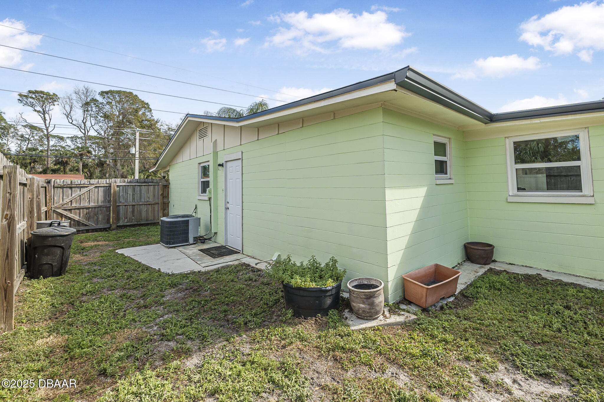 737 5th Street Port Orange, FL 32129 - Photo 39 of 40 a backyard of a house with table and chairs