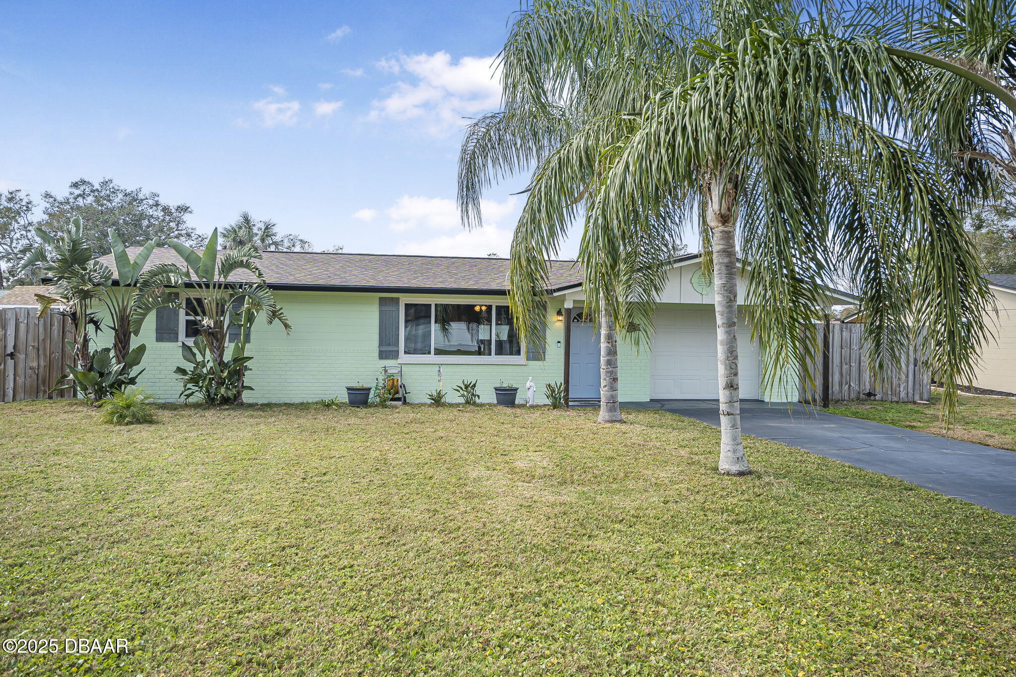 737 5th Street Port Orange, FL 32129 - Photo 5 of 40 a view of a house with a yard and tree s