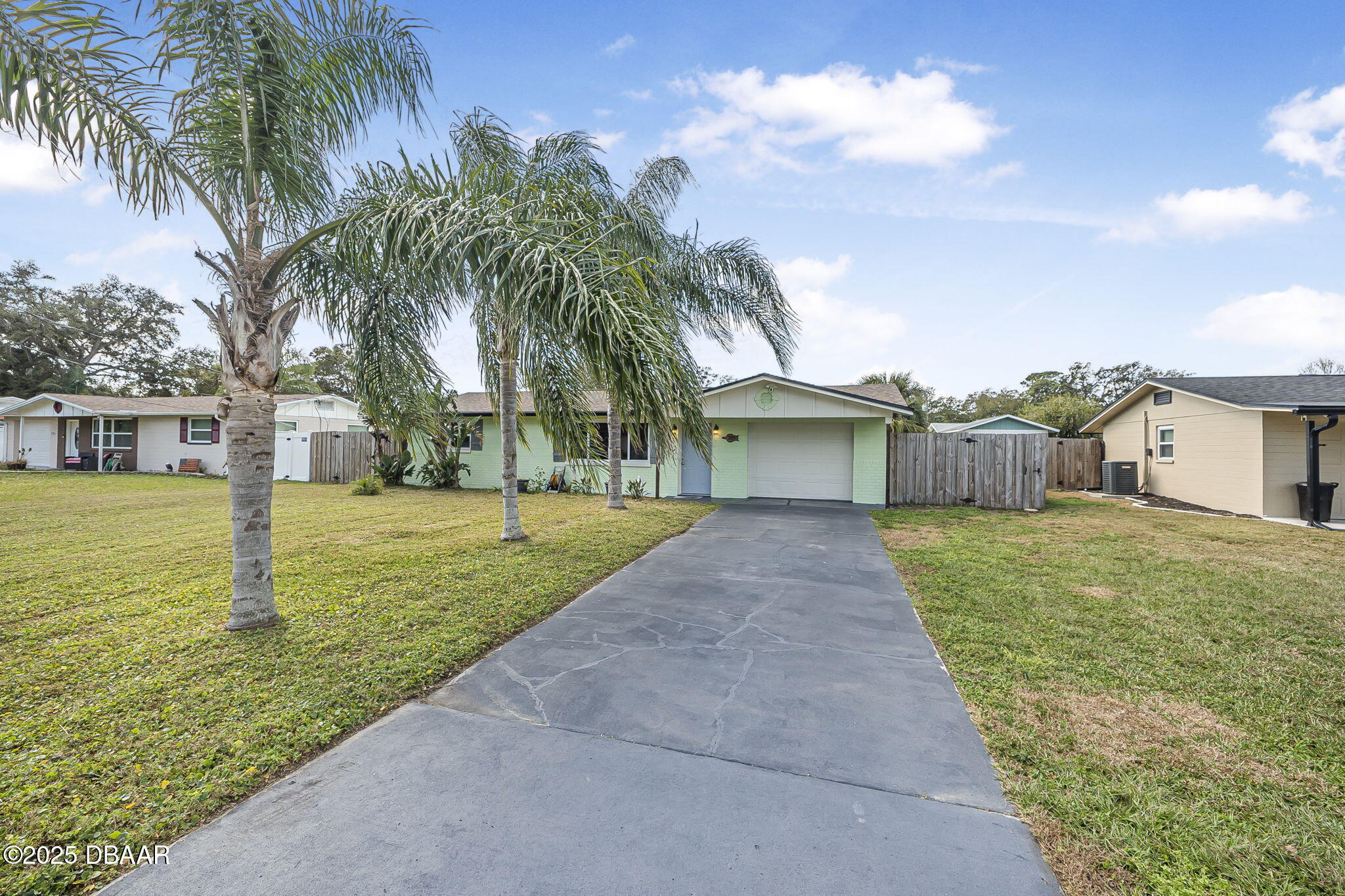 737 5th Street Port Orange, FL 32129 - Photo 6 of 40 a front view of house with yard and entertaining space