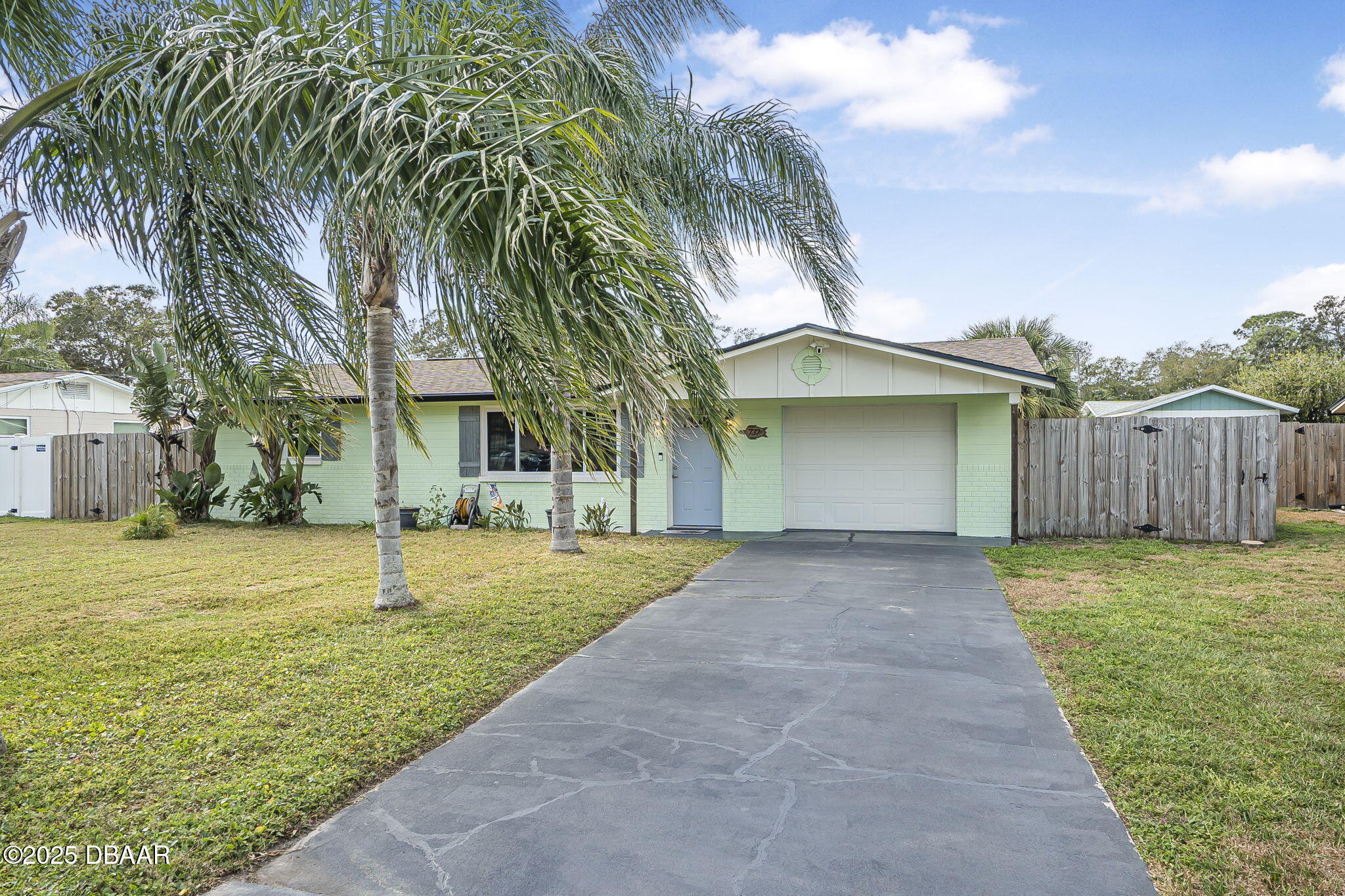 737 5th Street Port Orange, FL 32129 - Photo 7 of 40 a front view of a house with garden