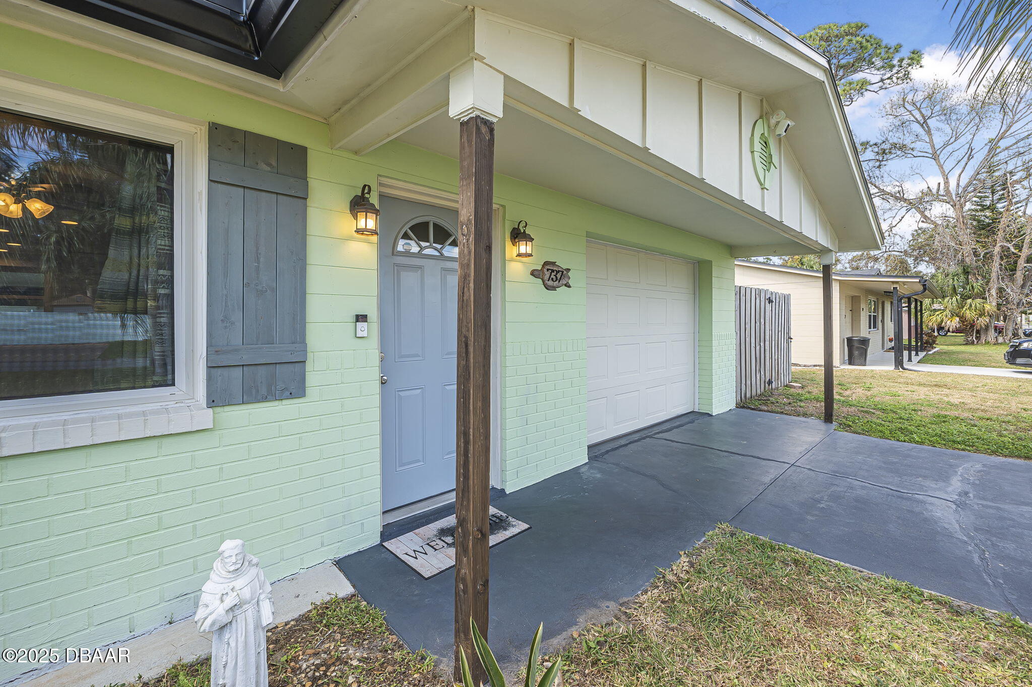 737 5th Street Port Orange, FL 32129 - Photo 8 of 40 a view of a house with a patio