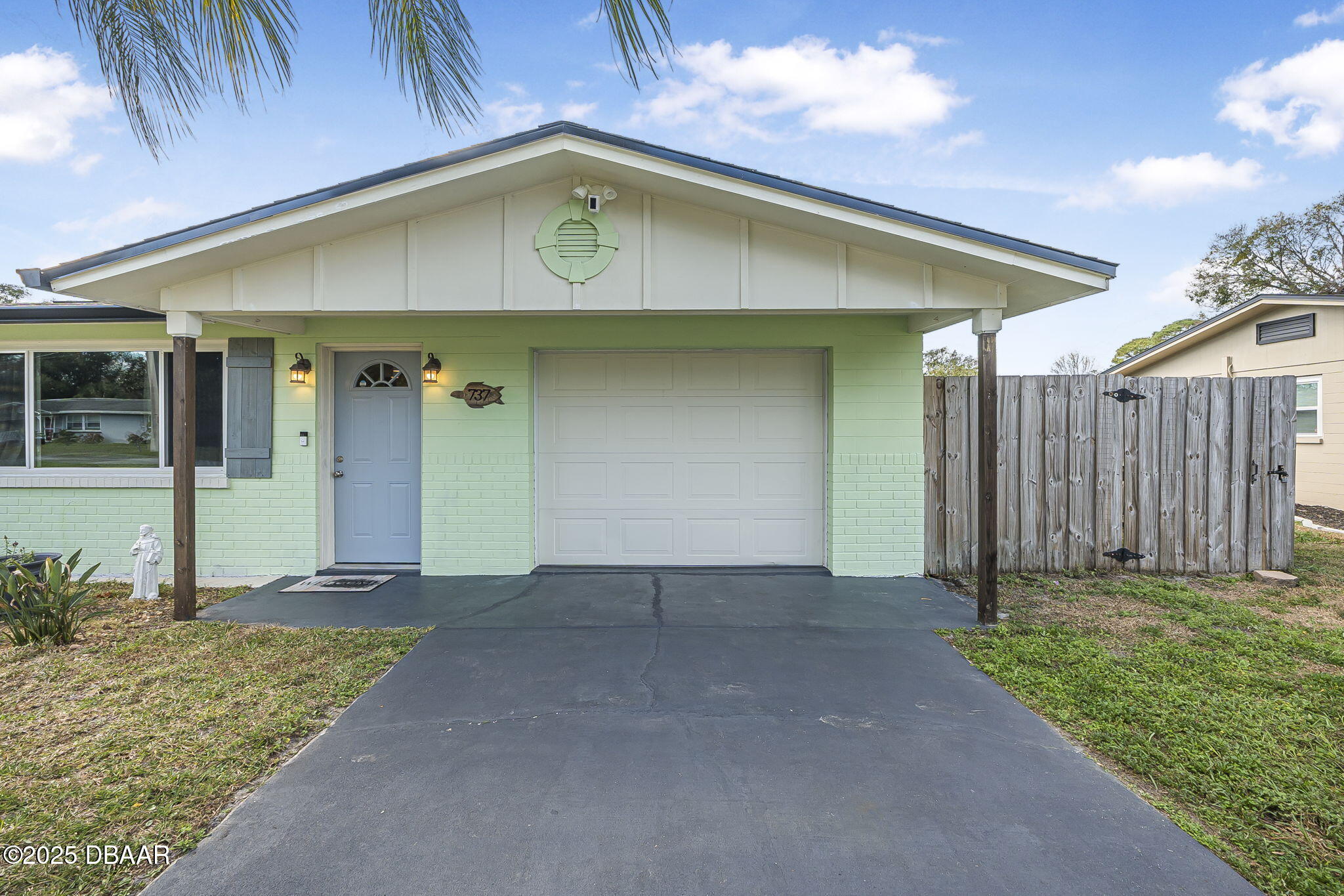 737 5th Street Port Orange, FL 32129 - Photo 9 of 40 a view of a house with a yard