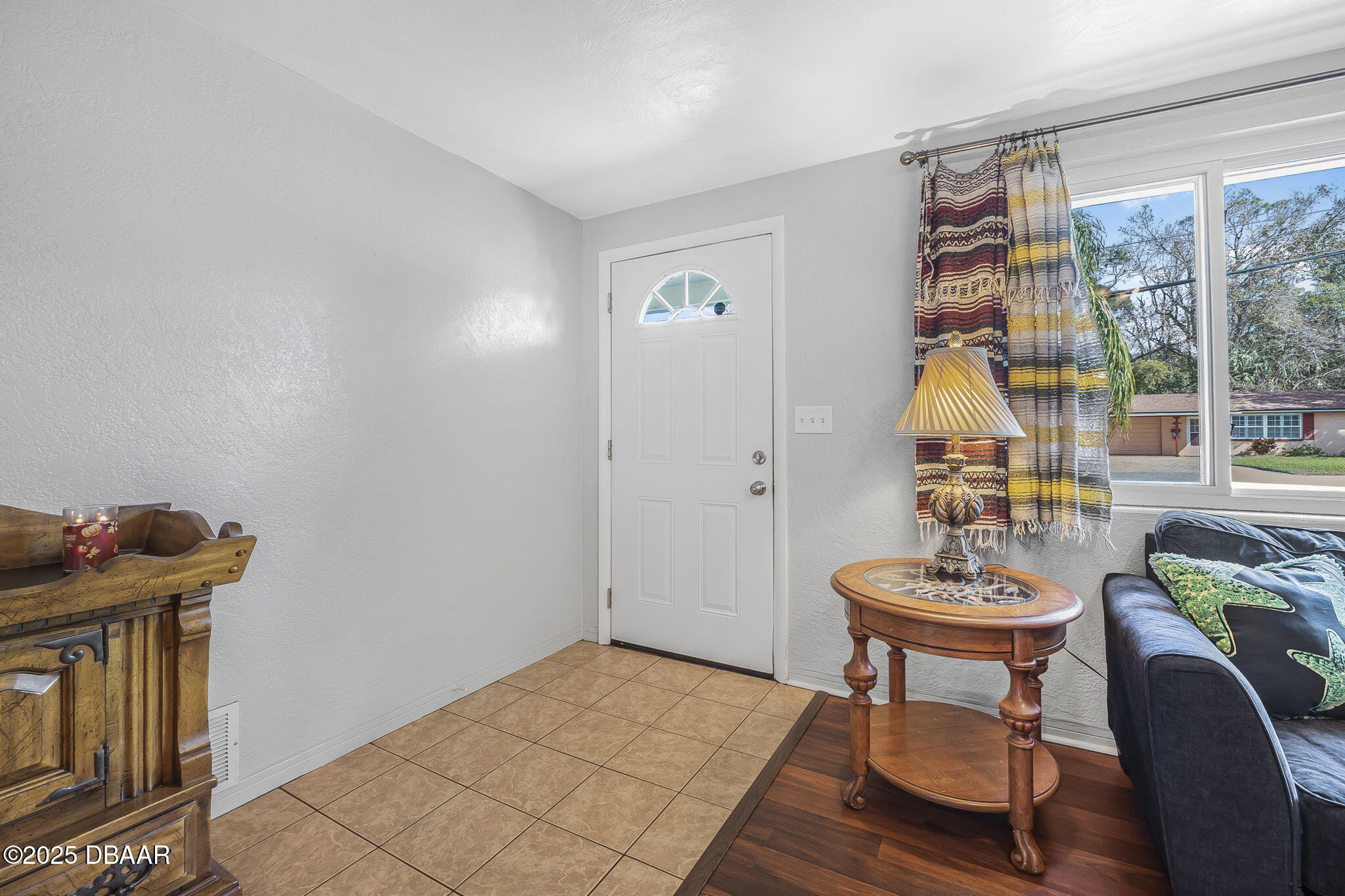 737 5th Street Port Orange, FL 32129 - Photo 10 of 40 a view of a livingroom with furniture and window